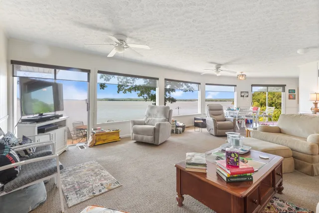 a kitchen with stainless steel appliances a refrigerator sink and microwave