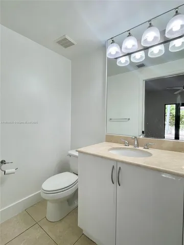 a view of a garden with wooden bench