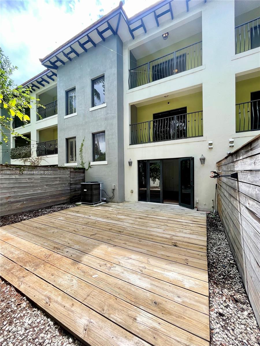 3204 Bird Avenue, Unit 105 Miami, FL 33133 - Photo 20 of 64 a front view of a house with a yard