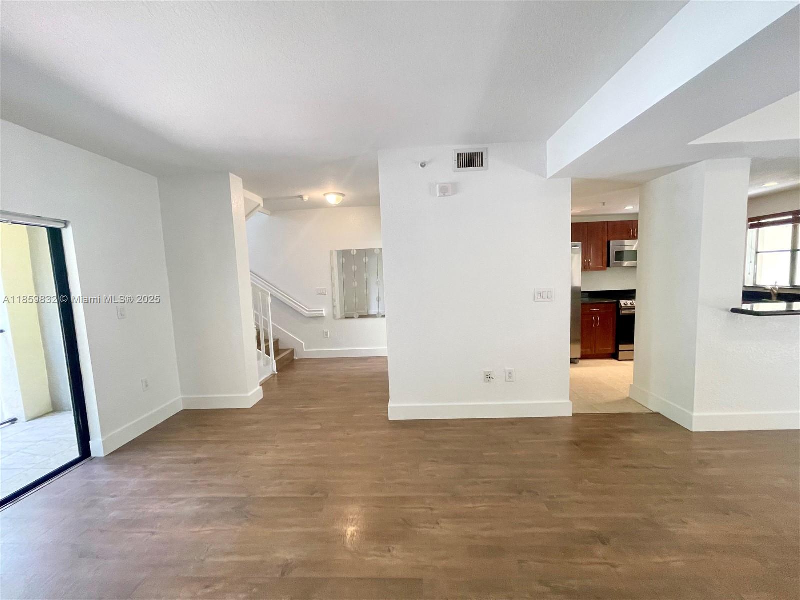 3204 Bird Avenue, Unit 105 Miami, FL 33133 - Photo 29 of 64 a view of empty room with wooden floor