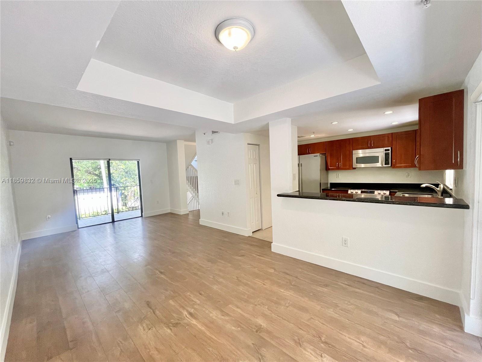 3204 Bird Avenue, Unit 105 Miami, FL 33133 - Photo 31 of 64 a view of a kitchen with an empty space and a window