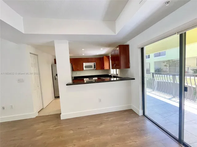 a view of entryway with wooden floor