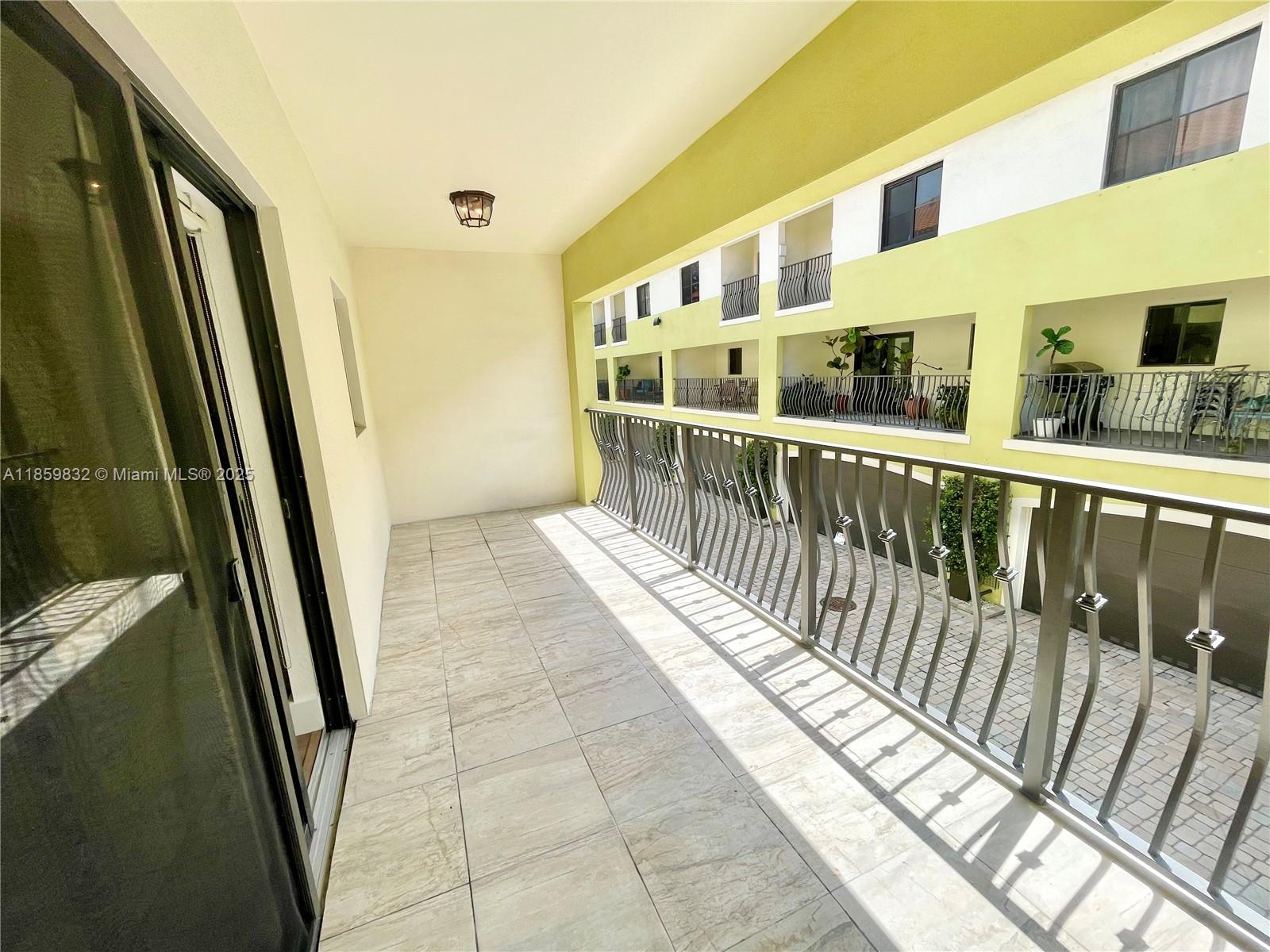 3204 Bird Avenue, Unit 105 Miami, FL 33133 - Photo 37 of 64 a view of balcony with furniture
