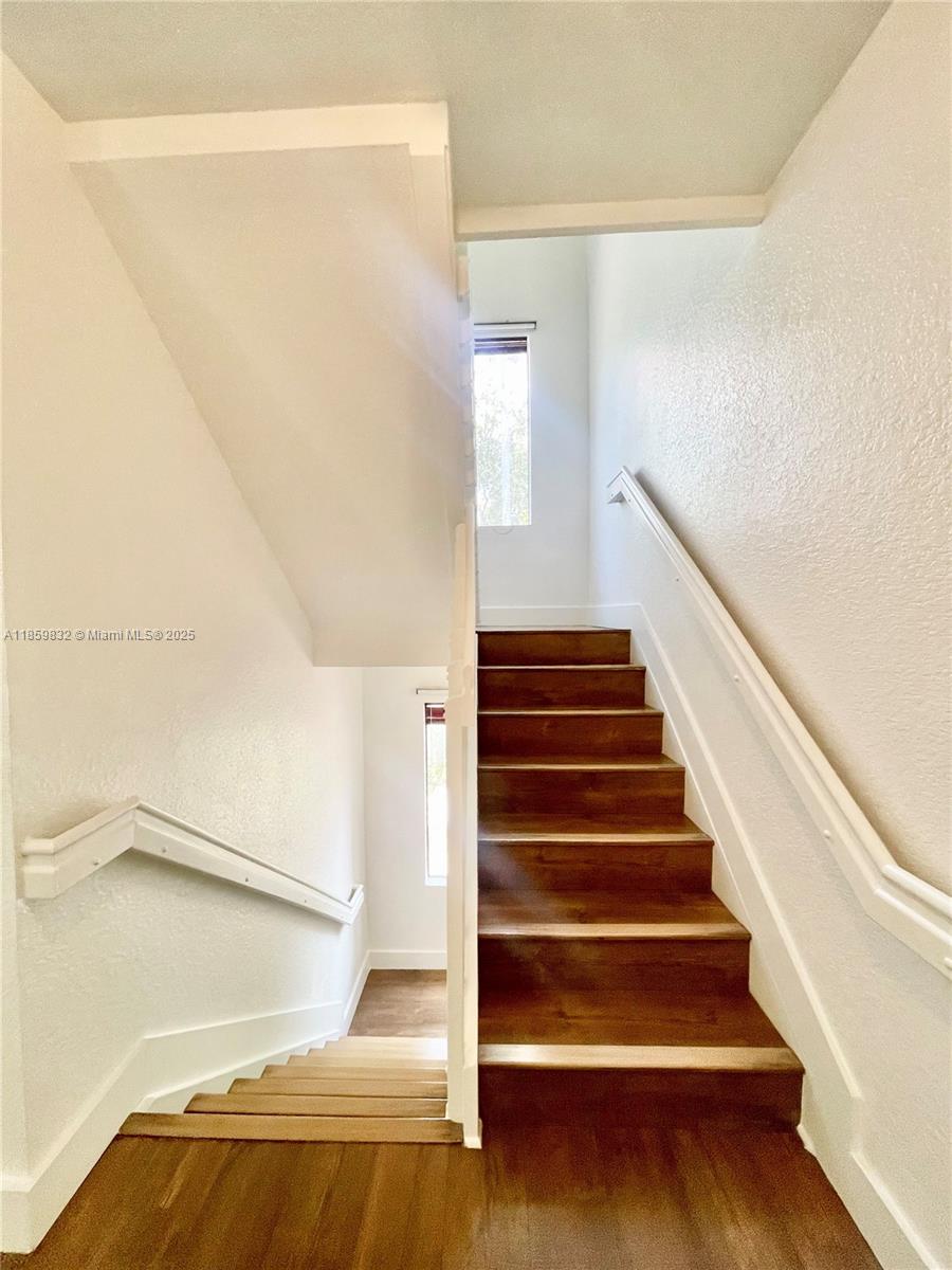 3204 Bird Avenue, Unit 105 Miami, FL 33133 - Photo 40 of 64 a view of entryway with wooden floor