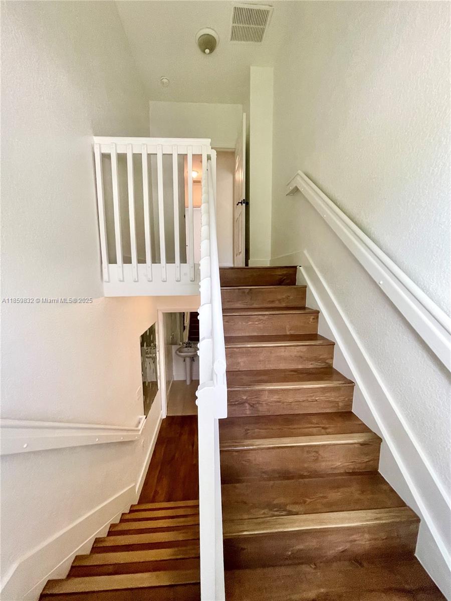3204 Bird Avenue, Unit 105 Miami, FL 33133 - Photo 41 of 64 a view of entryway and hall with wooden floor