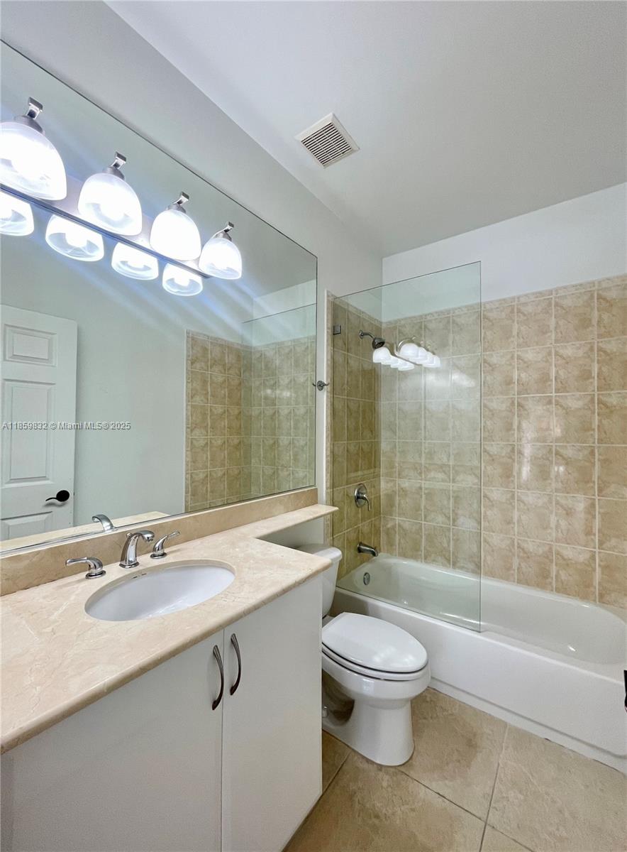 3204 Bird Avenue, Unit 105 Miami, FL 33133 - Photo 50 of 64 a bathroom with a sink toilet a mirror and shower