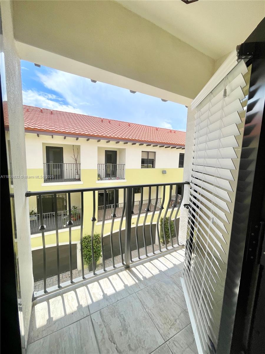 3204 Bird Avenue, Unit 105 Miami, FL 33133 - Photo 64 of 64 a view of a balcony with wooden floor