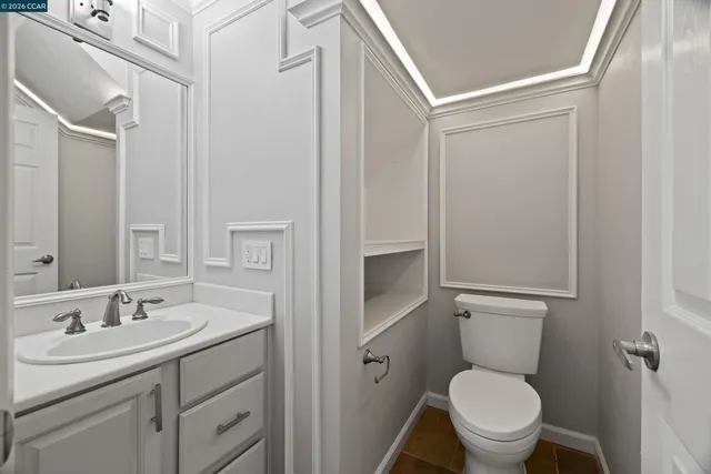a bathroom with a sink toilet and vanity