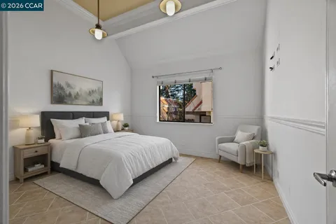 a bedroom with a bed and a couch