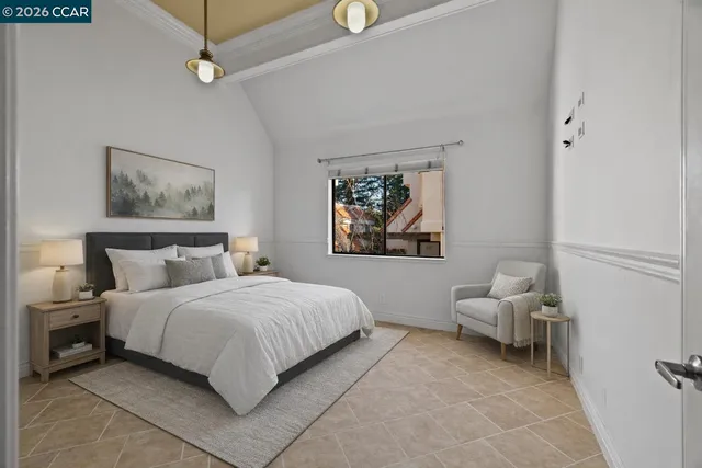 a bedroom with a bed and a couch