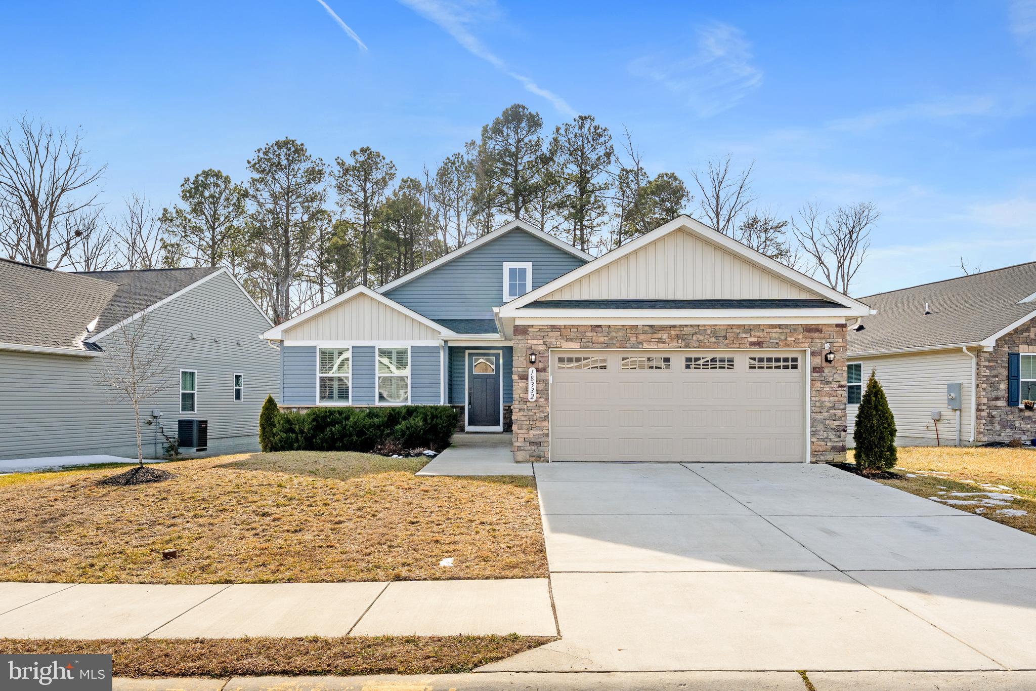 a front view of a house with garage