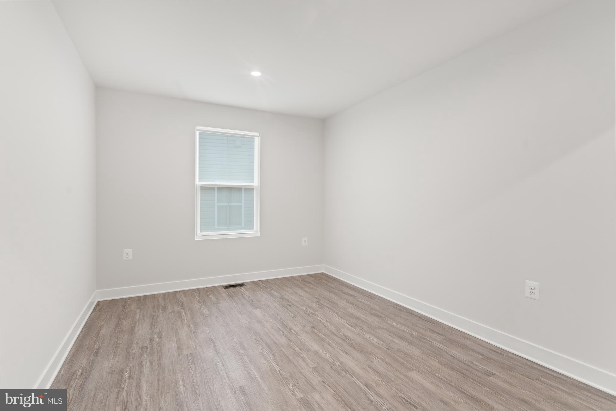 18332 Signature Way Ruther Glen, VA 22546 - Photo 11 of 50 a view of a room with wooden floor and window