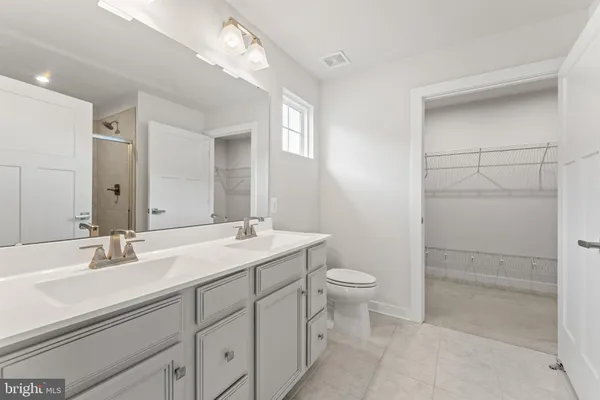 a bathroom with a glass shower door