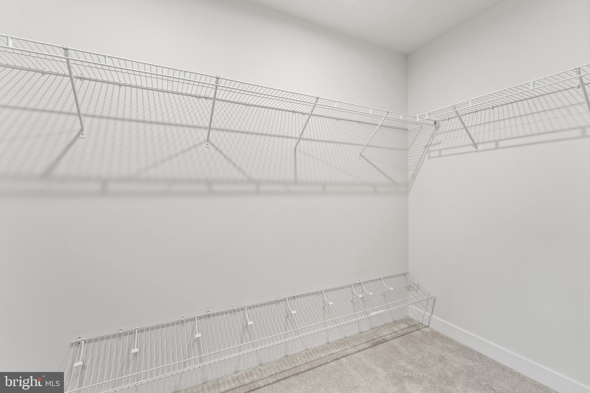 18332 Signature Way Ruther Glen, VA 22546 - Photo 20 of 50 a view of a room with racks on the wall