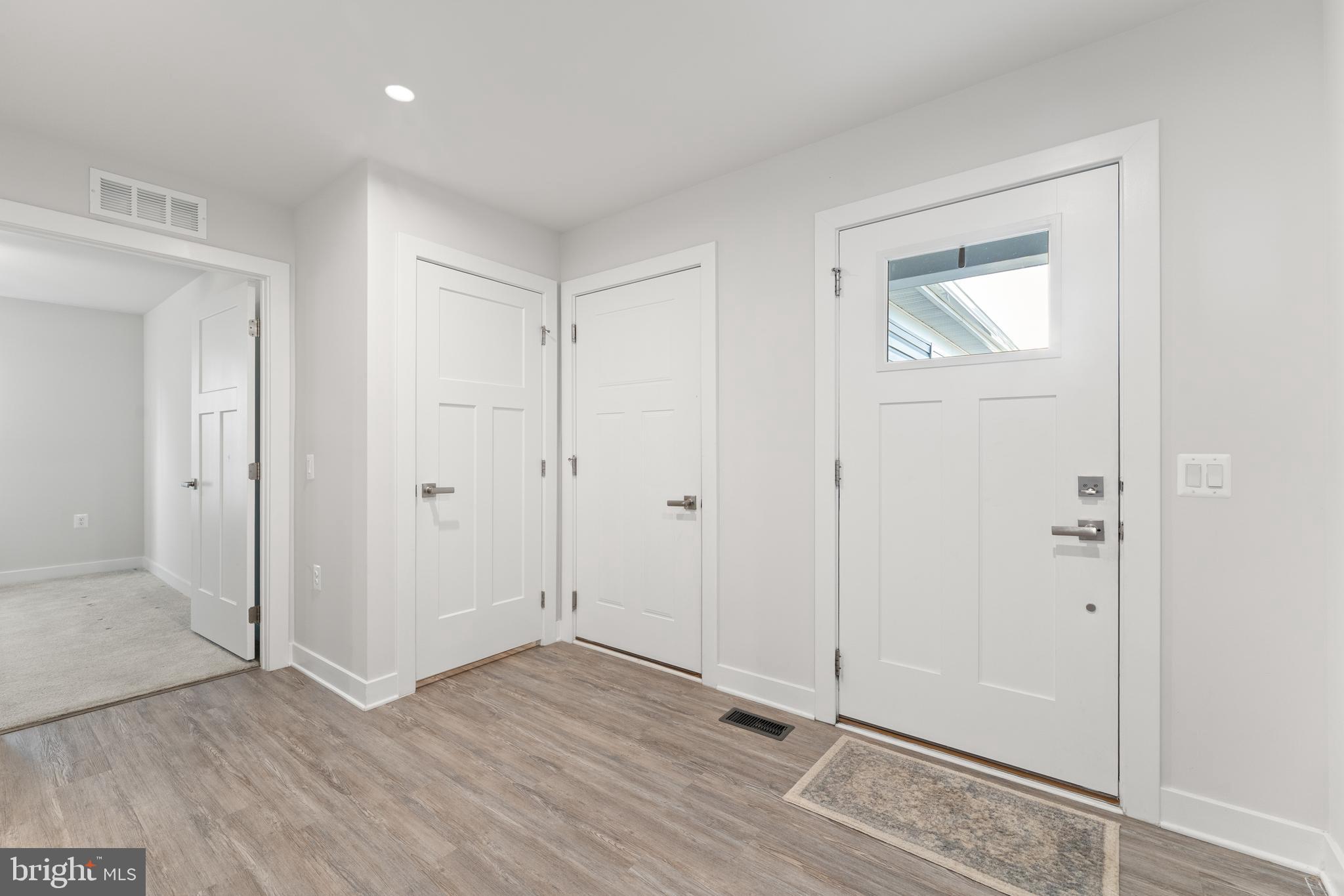 18332 Signature Way Ruther Glen, VA 22546 - Photo 3 of 50 wooden floor & windows in a room