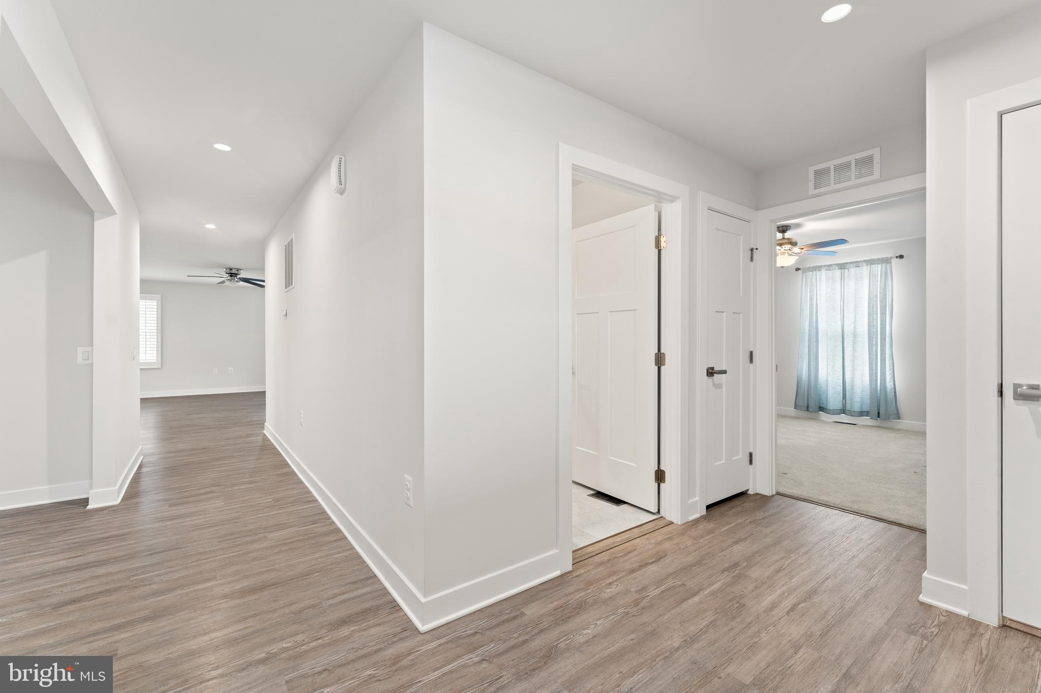 18332 Signature Way Ruther Glen, VA 22546 - Photo 4 of 50 a view of a hallway with wooden floor