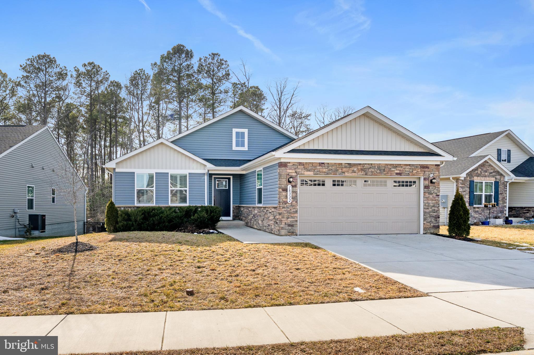 18332 Signature Way Ruther Glen, VA 22546 - Photo 43 of 50 a front view of a house with a yard and garage