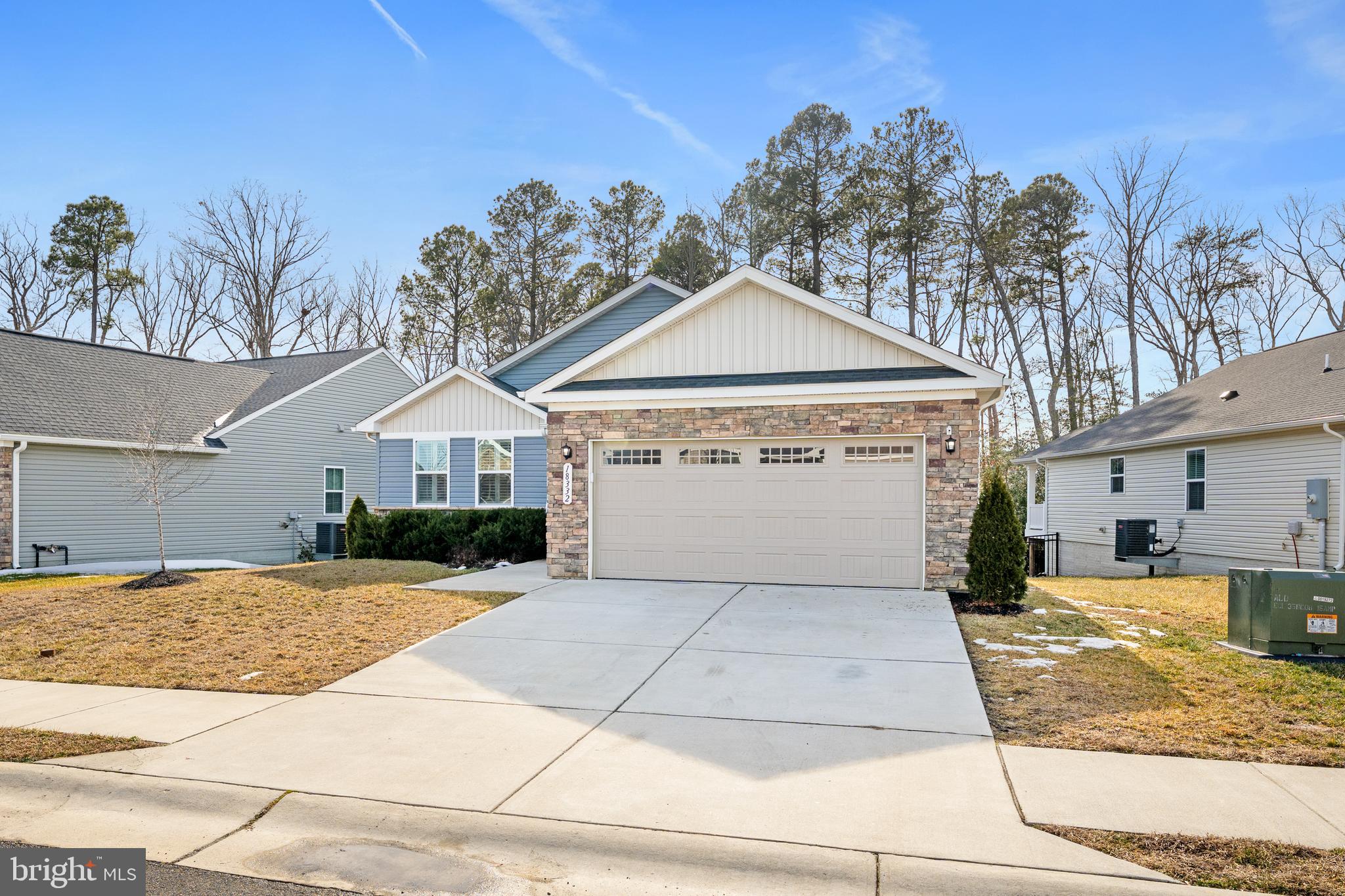 18332 Signature Way Ruther Glen, VA 22546 - Photo 45 of 50 a front view of a house with a yard and garage