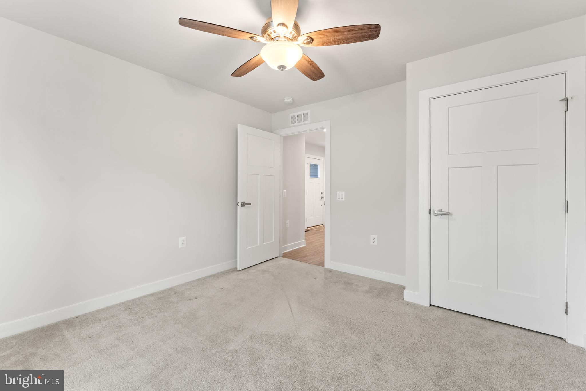 18332 Signature Way Ruther Glen, VA 22546 - Photo 6 of 50 an empty room with chandelier fan
