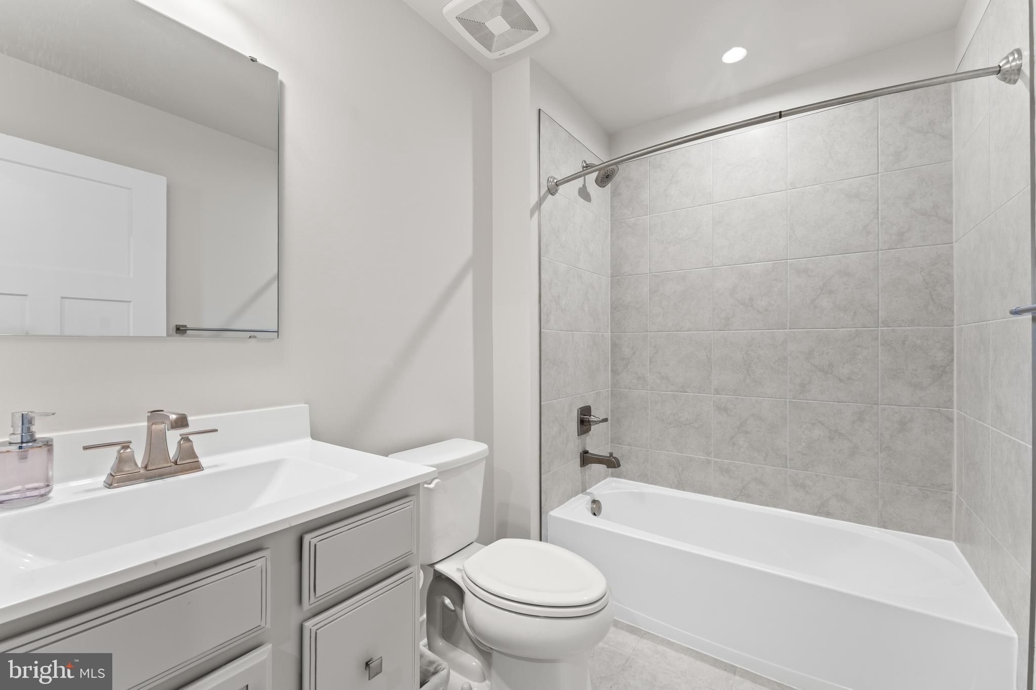 18332 Signature Way Ruther Glen, VA 22546 - Photo 7 of 50 a bathroom with a sink toilet and shower