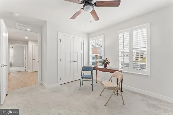 a view of a livingroom with furniture and windows