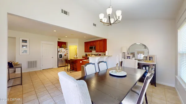 a view of a dining room with furniture window and outside view