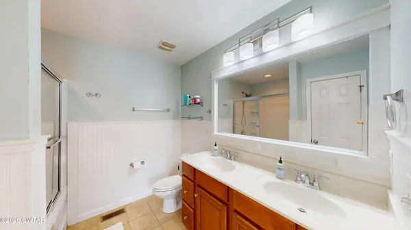 a bathroom with a tub and shower
