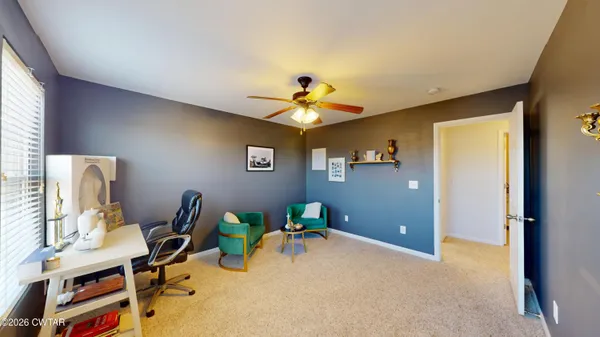 a workspace with furniture and window