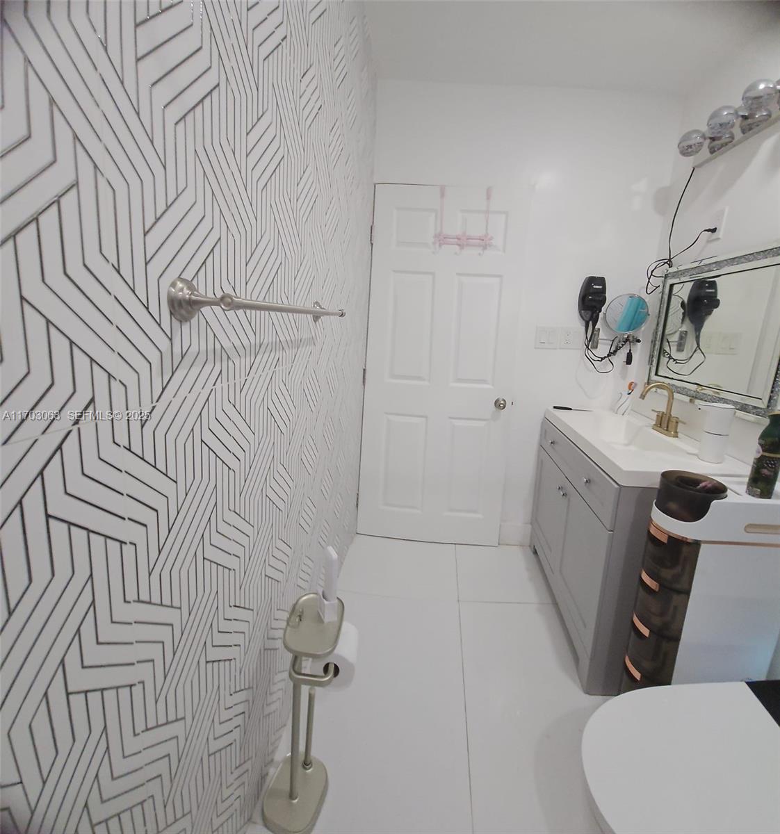 15700 Southwest 202nd Avenue Miami, FL 33187 - Photo 15 of 16 a bathroom with a sink toilet and shower