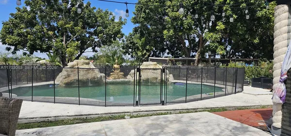 a view of outdoor space with garden and trees