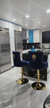 a kitchen with a sink appliances and cabinets