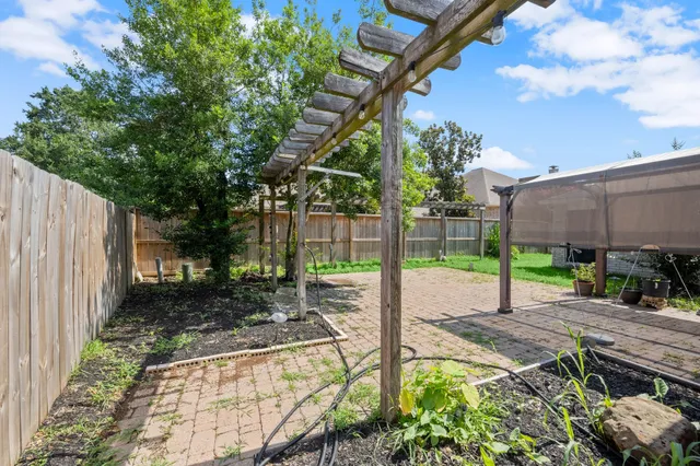 a view of a backyard with a garden