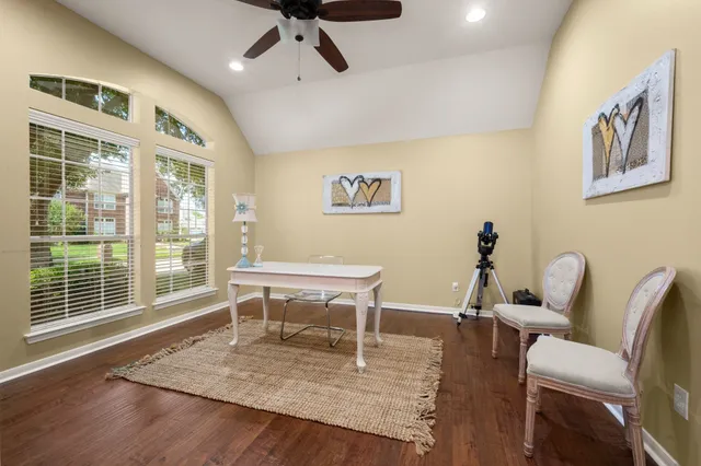 a view of a livingroom with furniture and a window