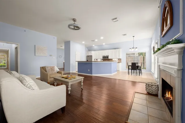 a living room with furniture and a fireplace