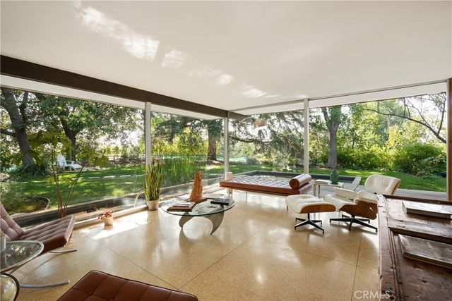 a swimming pool with outdoor seating and yard