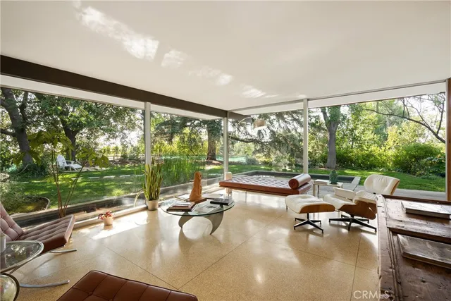 a swimming pool with outdoor seating and yard