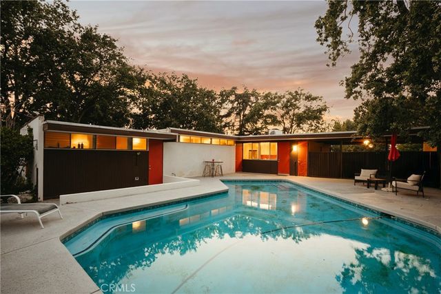 a view of a park with large trees