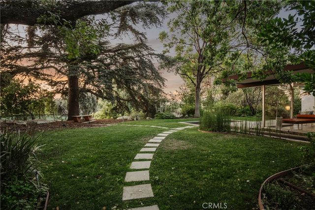 an aerial view of a house with a garden