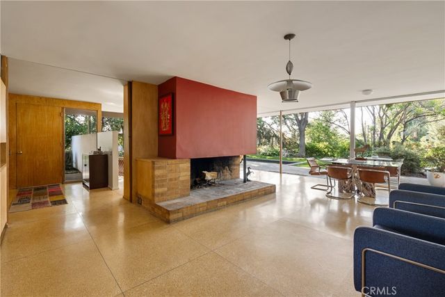 a lobby with furniture and a floor to ceiling window
