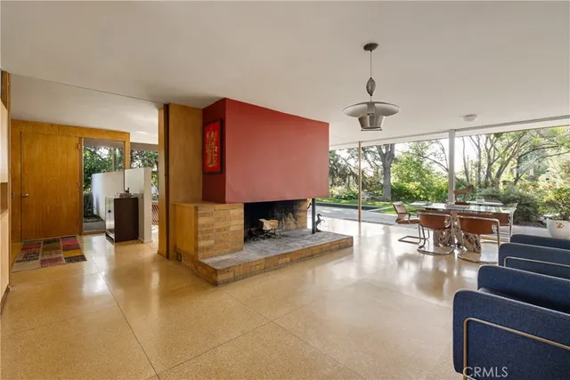 a lobby with furniture and a floor to ceiling window