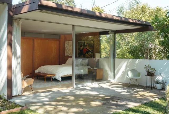 a view of a outdoor space with a patio and backyard