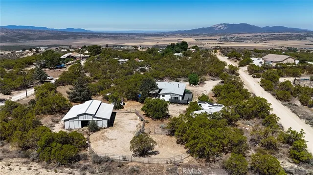 an aerial view of residential house with outdoor space