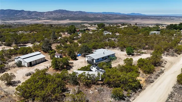 an aerial view of residential house with outdoor space