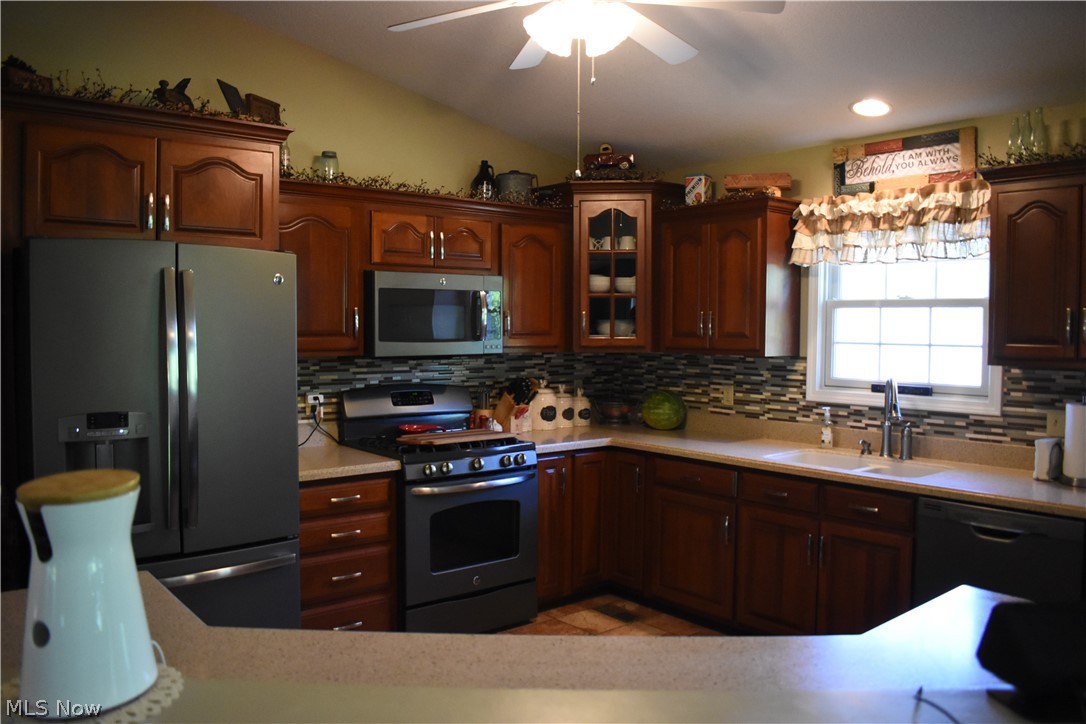 3563 Gorsuch Road Nashport, OH 43830 - Photo 3 of 32 The heart of the home! Great kitchen space with corian counters, glass tile back splash, ceramic floors, all appliances