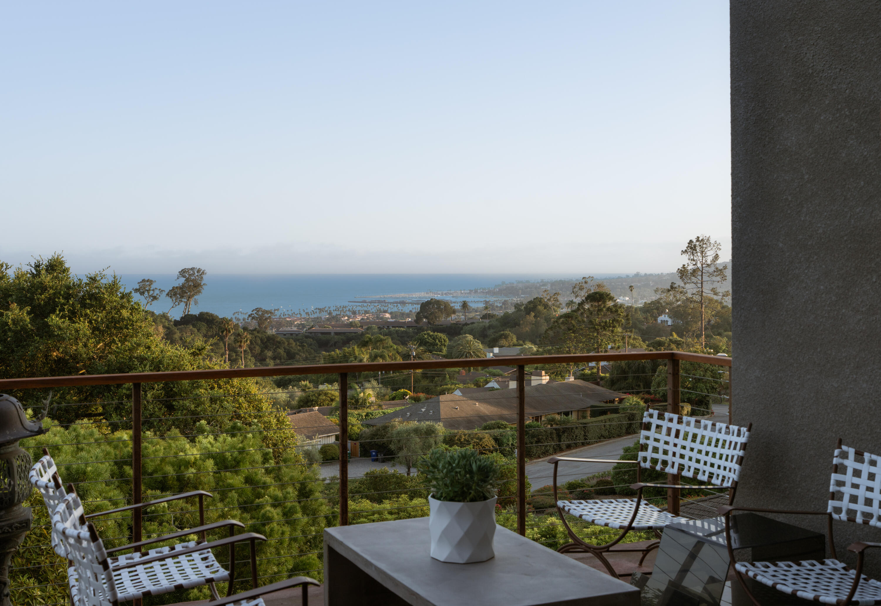 1944 Eucalyptus Hill Road Santa Barbara, CA 93108 - Photo 15 of 38 a view of a city from a balcony with outdoor seating
