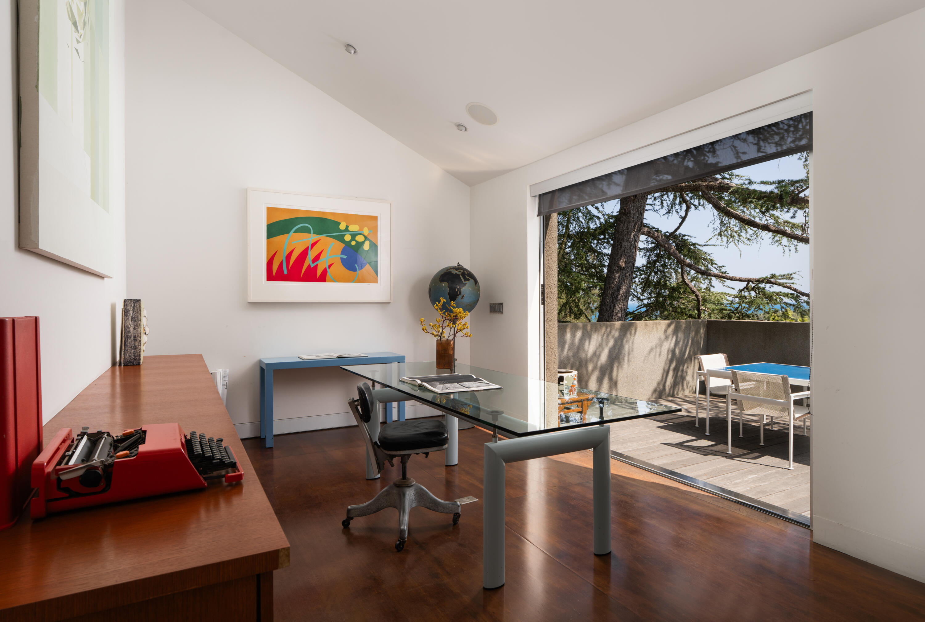 1944 Eucalyptus Hill Road Santa Barbara, CA 93108 - Photo 17 of 38 a view of a workspace with furniture and a floor to ceiling window