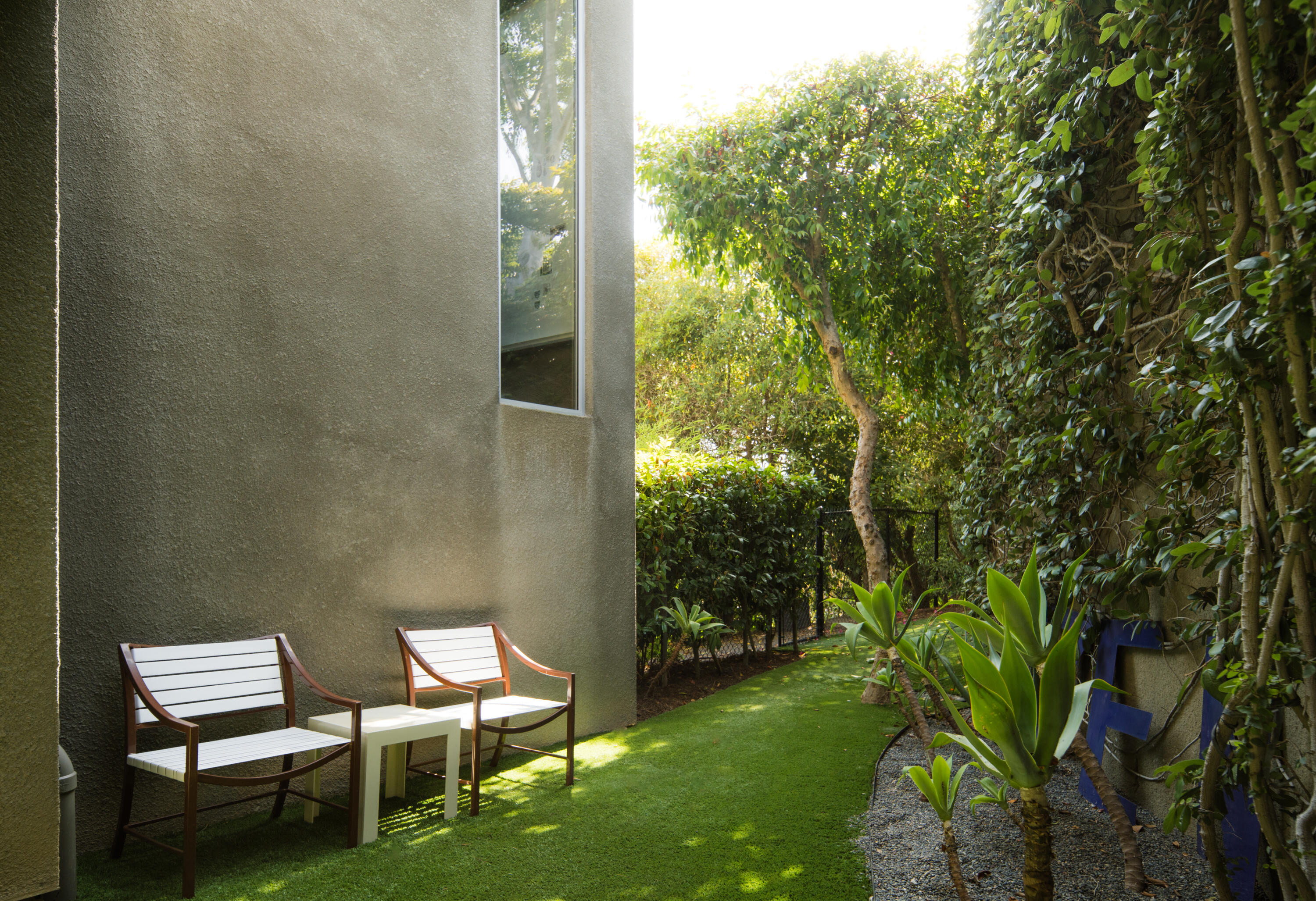 1944 Eucalyptus Hill Road Santa Barbara, CA 93108 - Photo 20 of 38 a view of a backyard with chairs