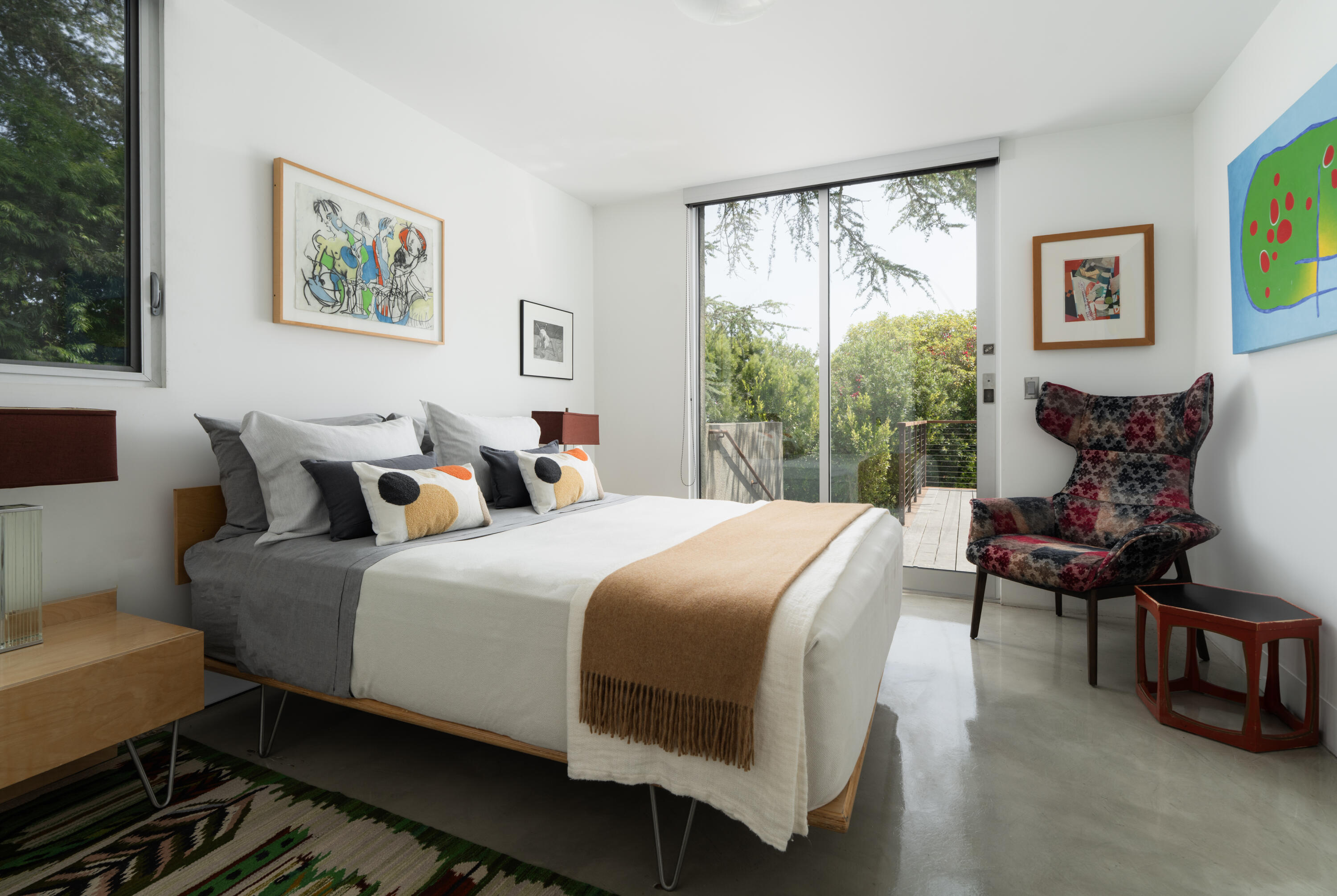 1944 Eucalyptus Hill Road Santa Barbara, CA 93108 - Photo 22 of 38 a bed room with a bed and a chair