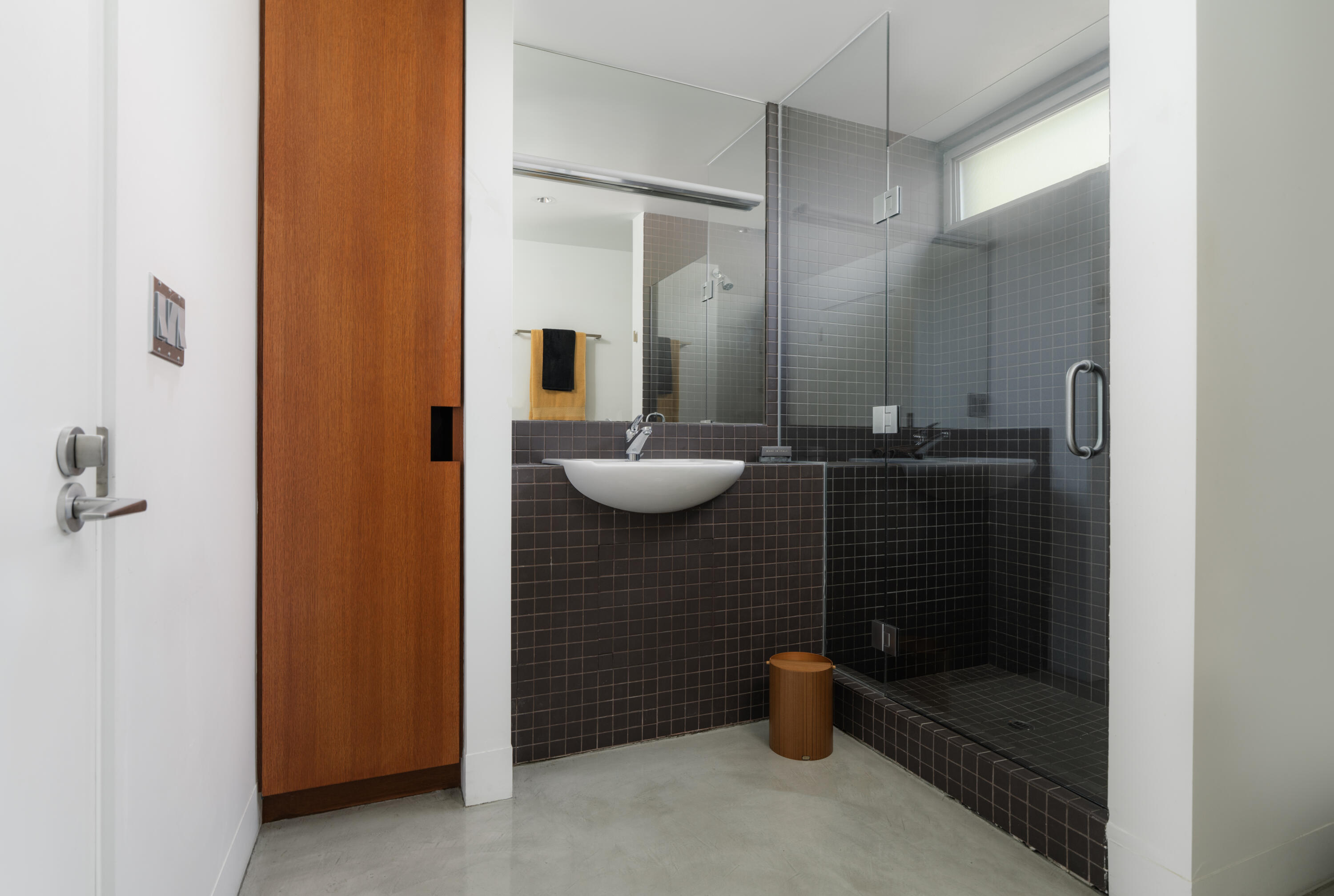 1944 Eucalyptus Hill Road Santa Barbara, CA 93108 - Photo 24 of 38 a bathroom with a granite countertop sink and a mirror