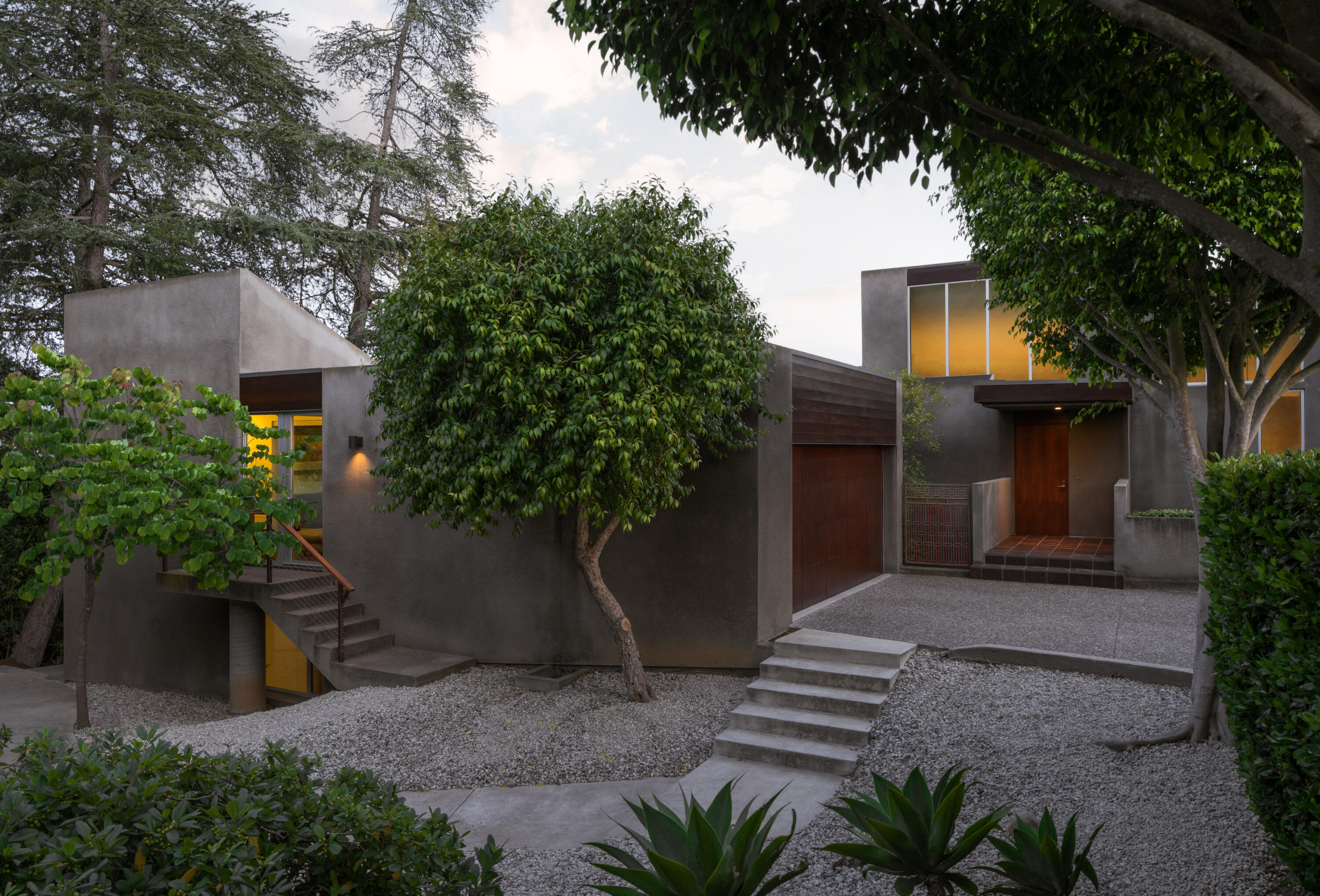 1944 Eucalyptus Hill Road Santa Barbara, CA 93108 - Photo 33 of 38 a front view of a house with a yard and a garage